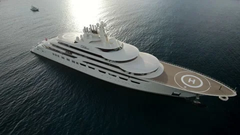 Aerial close orbit over the Dilbar, a mega-yacht of the Russian Stock Footage 171334805