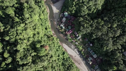 Aerial close up orbit shot  over Bohorok River in Bukit Lawang , Sumatra Stock Footage 221656573