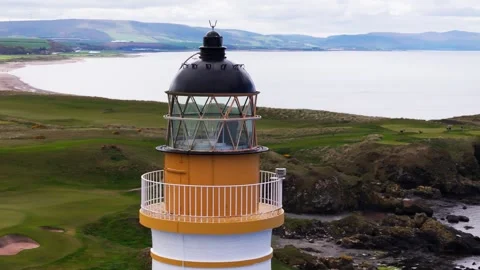 Aerial Close-Up Orbital View Of Lighthouse Beacon And Golf Course Vídeos de archivo 333955976