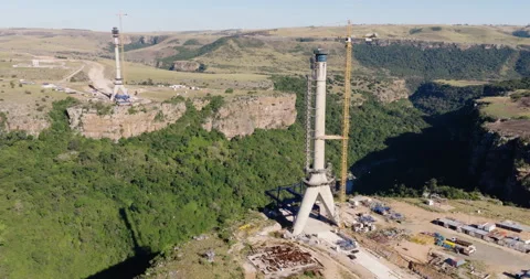 Aerial close-up panning construction of Msikaba Bridge in the Eastern Cape, SA Stock Footage 340130897