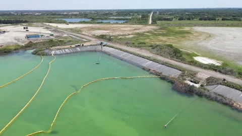Aerial close-up of Piney Point phosphate pool cleanup and pump Stock Footage 154236206