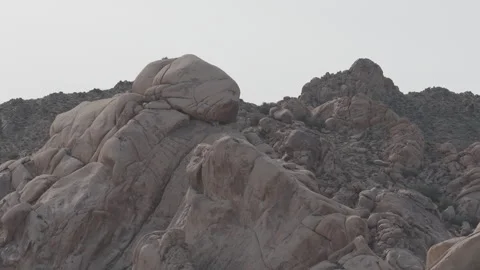 Aerial close up of rock formations in Searchlight Nevada desert in Pro Res Stock Footage 331459730