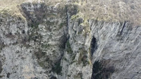 Aerial Close-up of Rugged Limestone Cliffs at Vikos Gorge – Vertical Rock 스톡 동영상 330989552