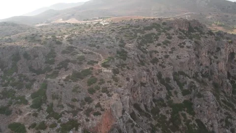 Aerial close-up shot of viewpoint of gorge cliffs and wild terrain Stock Footage 344547864