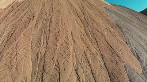 Aerial close-up side view on abstract patterns on potash mountains. Stock Footage 170552351