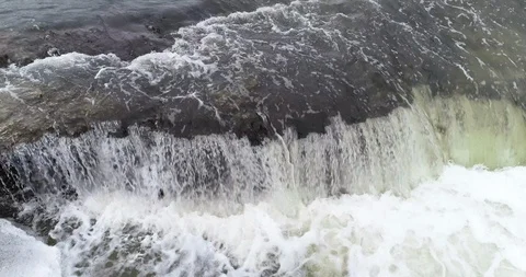 Aerial close up of small water fall in slow motion 库存影片 102533374