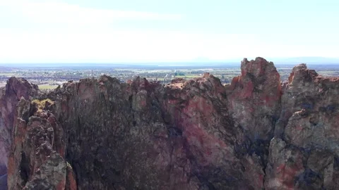 AERIAL CLOSE-UP OF SMITH ROCK STATE PARK IN CENTRAL OREGON Stock Footage 151057567