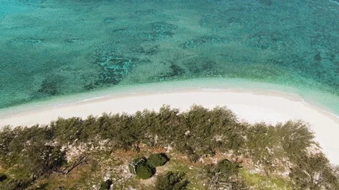 Aerial: Close up of tranquil empty beach on tropical island, turquoise water Stock Footage 116752122