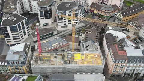 Aerial close view of construction site with cranes in Montreux Switzerland Stockbeeldmateriaal 332633358