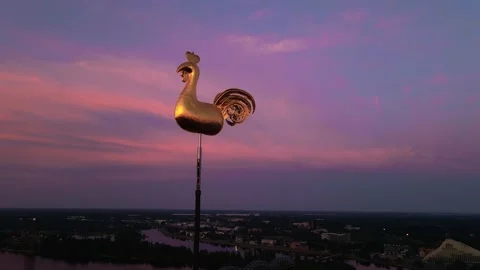 Aerial close view of golden weather cock or rooster in Riga Old Town during Stock Footage