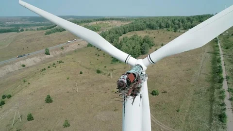 Aerial close-up view of a huge broken windmill. Clear sunny day. Wind power Stock Footage 220108862