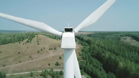 Aerial close-up view of a huge windmill rotating. Clear sunny day. Wind power Video stock 220109030