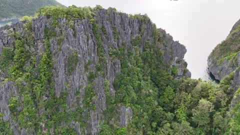 Aerial Close View of a Limestone Cliff in El Nido Video stock 347595679