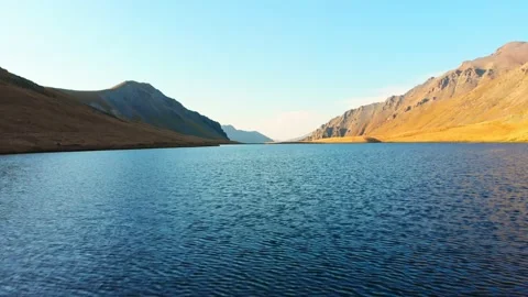 Aerial close up view over alpine lake in tranquil countryside in caucasus m.. Stock Footage 233041265