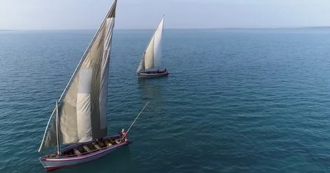 Aerial close-up view of two traditional dhow sailing boats fihsing on a Stock Footage 85262770
