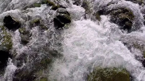 Aerial: Close up Views of River flowing over Rocks/Flooding Stock Footage 72822618