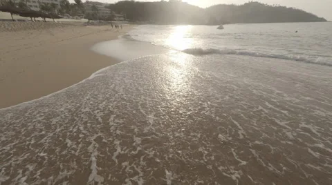 Aerial close to waves on shore Stockbeeldmateriaal 50039750