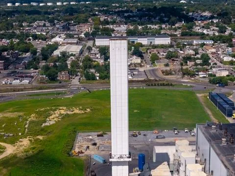 Aerial close up of white exhaust stack at waste to energy facility Stock Photos