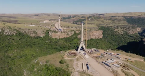 Aerial close-up zoom in construction of Msikaba Bridge in the Eastern Cape, SA Stock Footage 340130890