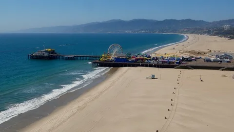 Aerial of closed Santa Monica pier during Corona virus pandemic Stock Footage