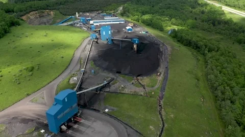 Aerial closeup of coal mining machine tower with elevator for loading coal into 库存影片 133015828