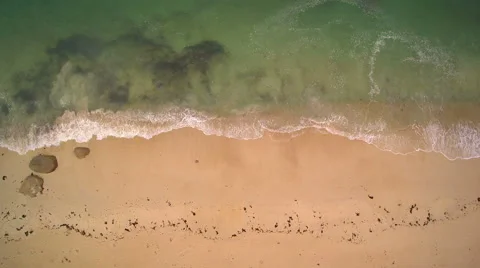 Aerial closeup - Hovering the seaside until a granite rock protrusion. Stock Footage 67658439