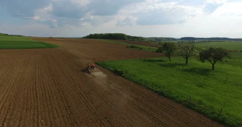 Aerial closeup from tractor in field. Video stock 62906812
