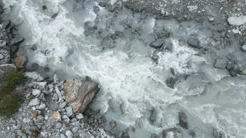 Aerial closeup view of drone flying on alpine glacial river on italian alps Stock Footage 256204572