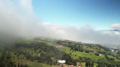 Aerial of cloud layer above Costa Rican Farms in Poas volcanic region Stock Footage 330210249