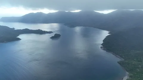 Aerial of Clouds Drifting Over Horseshoe Bay, Komodo National Park Stock Footage 247529068