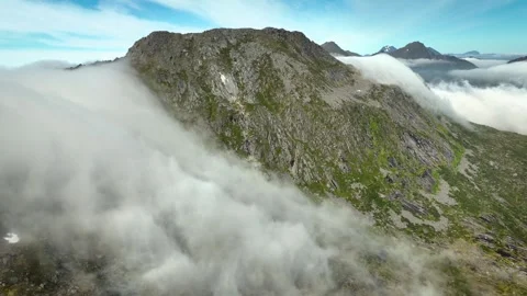 Aerial of of the clouds flowing over a mountain in Norway 動画素材 333202774