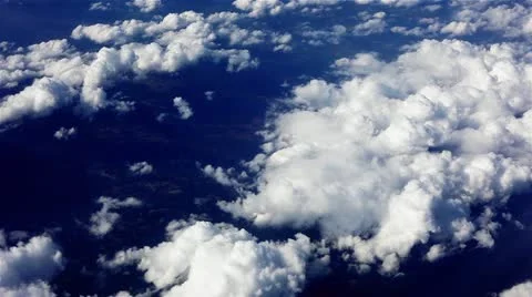 Aerial Clouds, looking down at puffy white clouds in blue sky Stock Footage 10979468