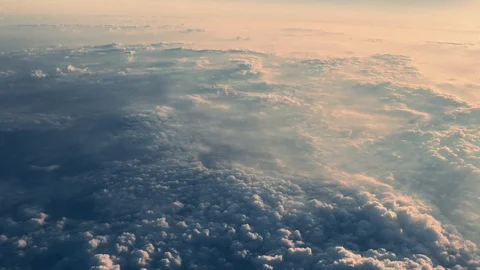 Aerial of clouds over the blue sky. shooting from inside an airplane. Stock-Footage 93698694