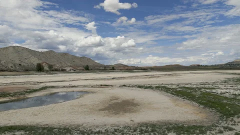 Aerial-Clouds tease but bring no relief to drought stricken reservoir Stock Footage 204503301