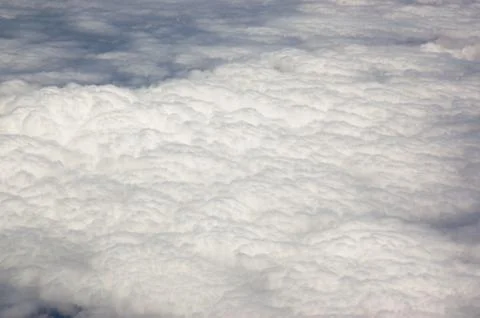 Aerial cloudscape during a day flight Stock Photos