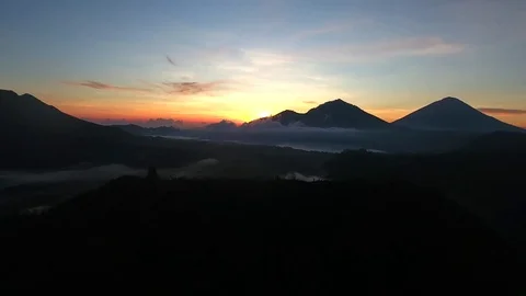 Aerial of cloudscape, mountain and vegetation at sunset Video stock 81448496