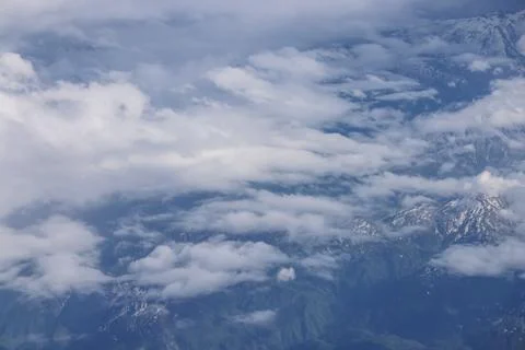 Aerial cloudscape over mountain range landscape Stock Photos