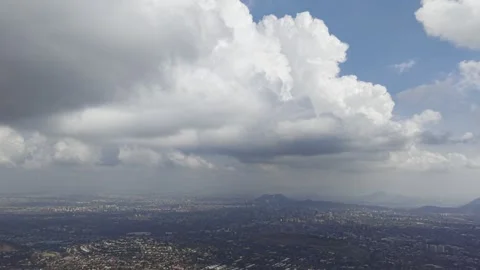 Aerial Cloudscape Over San Carlos de Apoquindo and Santiago Stock Footage 338009466