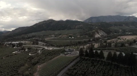 Aerial: Cloudy Fall/Dusk Orchard Valley Over Farm Rural Area Stock Footage