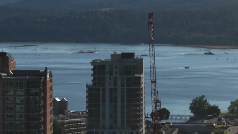 Aerial of coeur dAlene waterfront development and construction crane in Idaho Stock-Footage 337516650