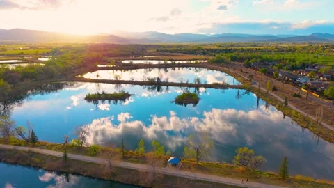Aerial Colorado Ponds Cloud Reflection Golden Sunset Rocky Mountains Stock Footage 332808592