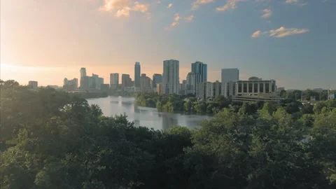 Aerial: Colorado River & downtown Austin at sunrise. Texas, USA Stock Footage