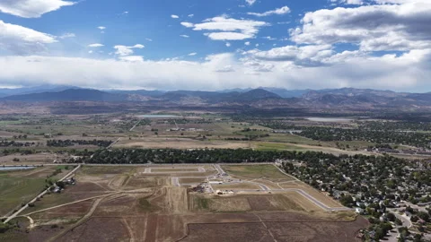 Aerial of community development under construction in Loveland Colorado Stock Footage 345347465