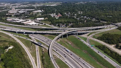Aerial of complex highway interchange of Interstate 49 and 470 in Kansas City Stock Footage 344810983