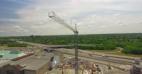 Aerial construction Crane shot in motion on construction site in Canada Stock Footage 64067549
