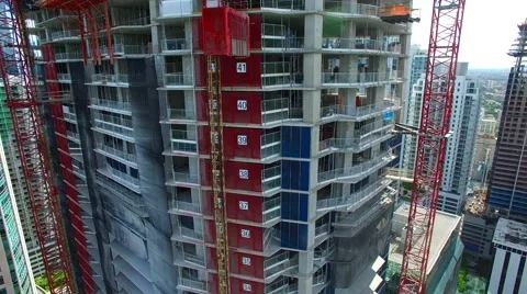 AERIAL - Construction elevator arriving Stock Footage 65153938