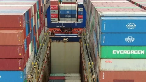 Aerial: Container crane loading containers onto a Container Ship Stock Footage 149898970