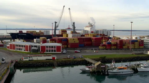 Aerial of container ship being unloaded Stock Footage 155372722