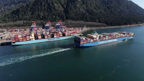 Aerial: Container ship leaving the harbour Stock Footage 149782289