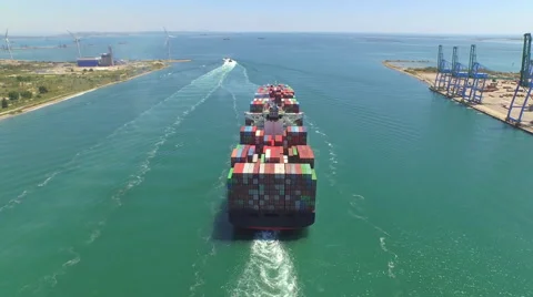 AERIAL: Container ship, loaded with shipping freight containers leaving port Stock Footage 61257155